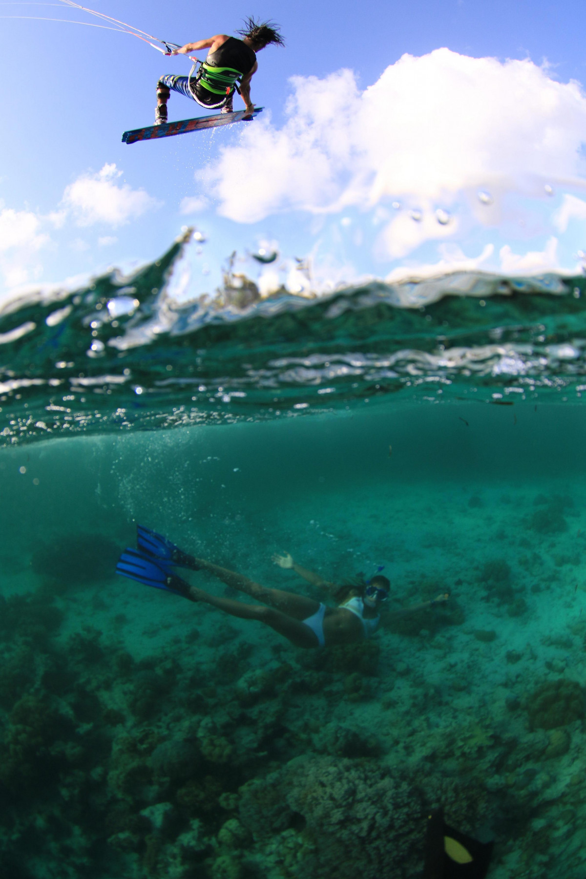 Tom Court kiting and writer Sophie Mathews underwater