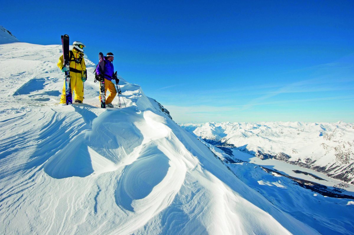 Two people about to ski