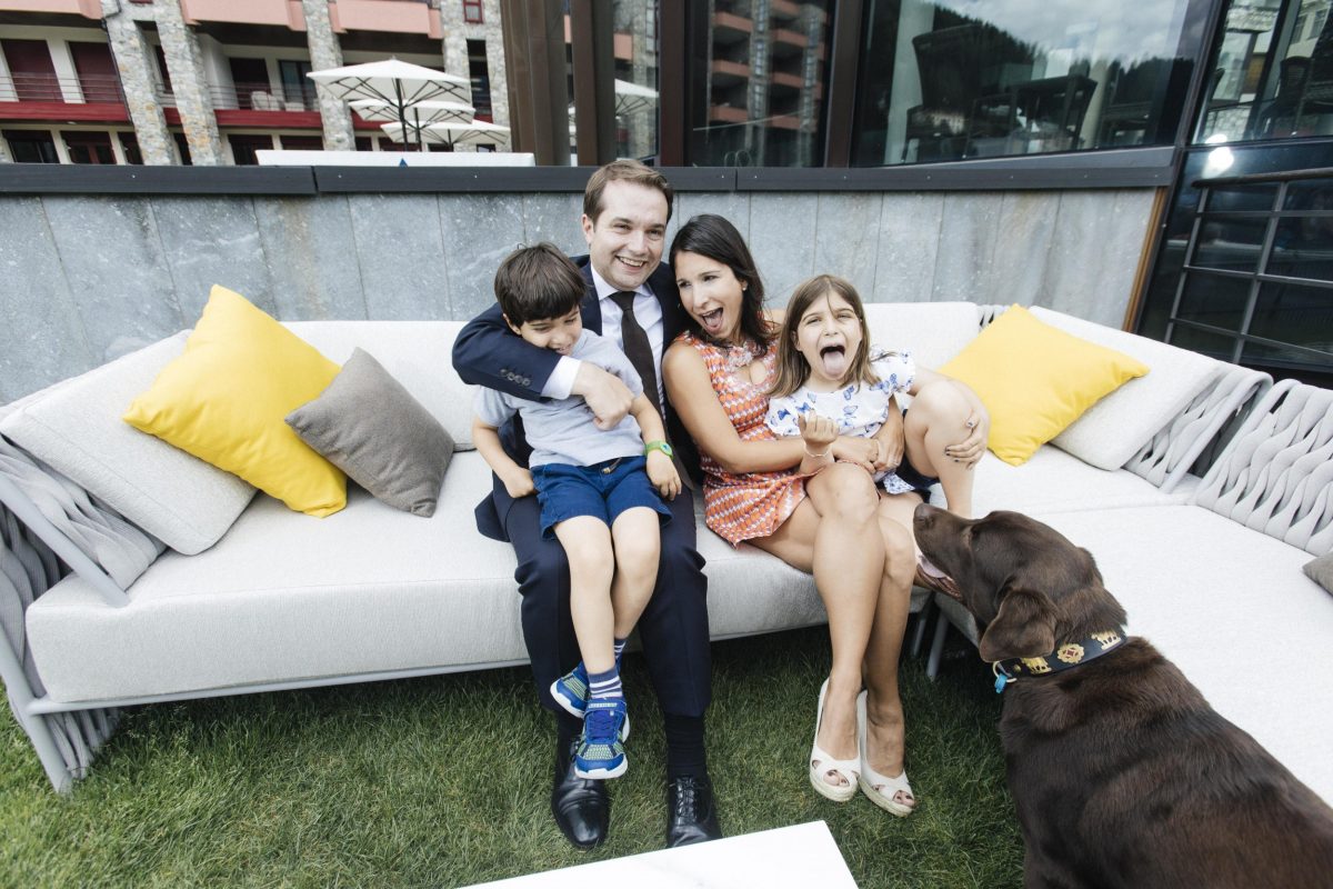 Mr Leuenberger with his wife Vanessa, children Robert and Penelope, and dog Patrón, in the gardens of Badrutt’s Palace Hotel