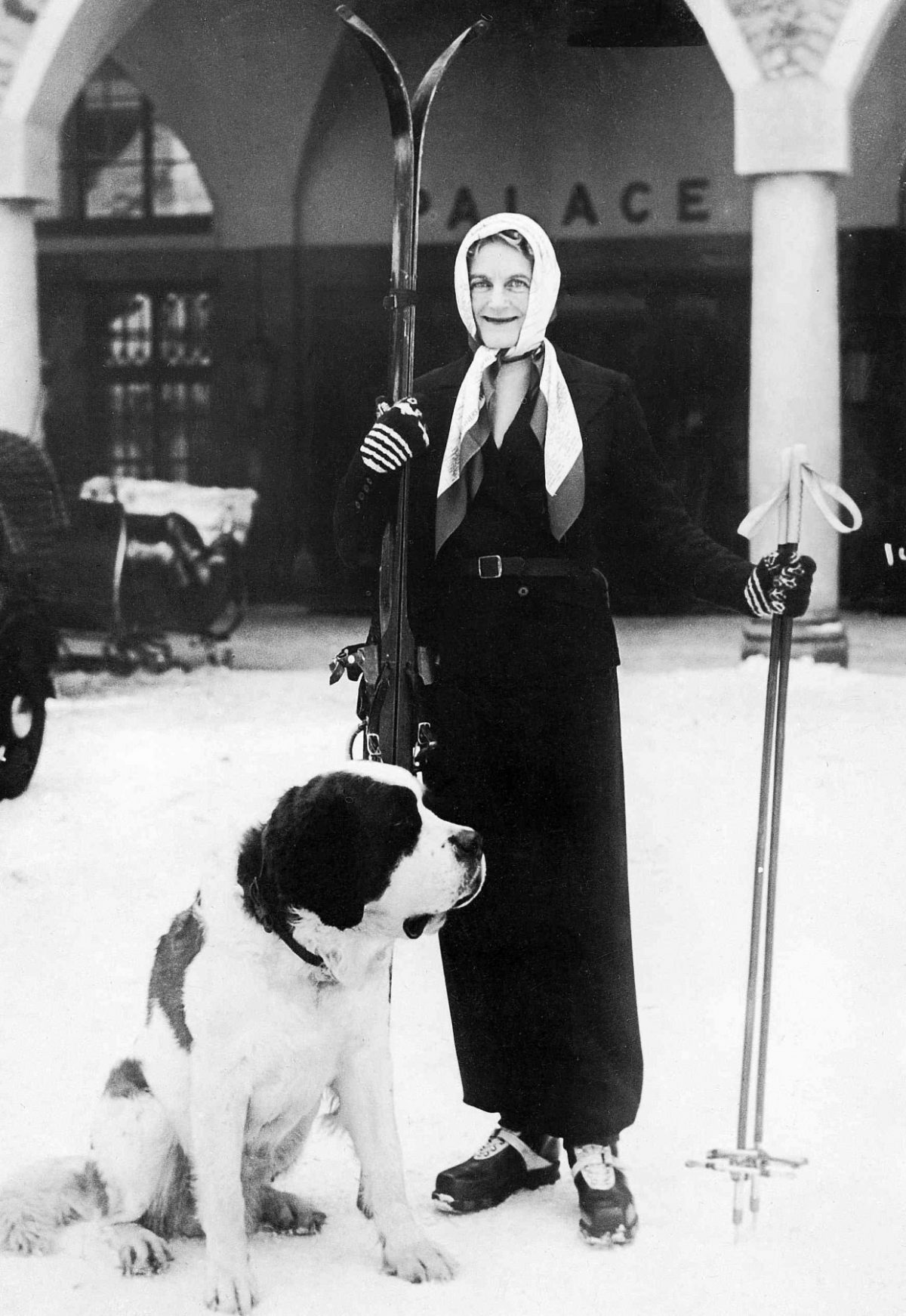 Black and white picture of Clementine Churchill and dog in St. Moritz Imagno/Getty Images