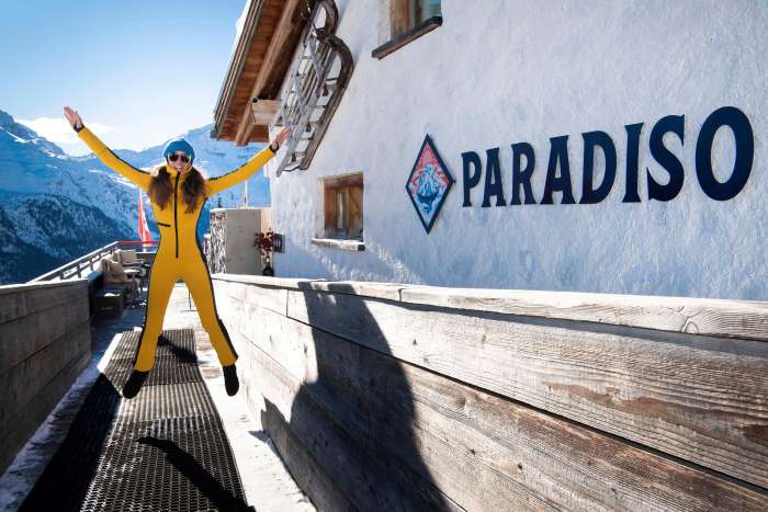 A skier outside Paradiso restaurant in St. Moritz