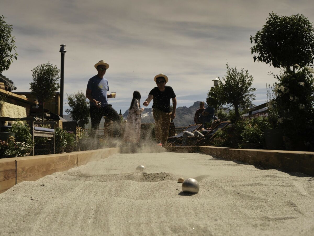 People playing petanque or boules at Paradiso Mountain Club & Restaurant, St. Moritz