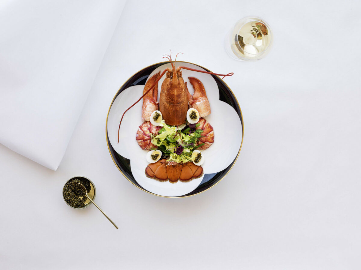 Lobster salad dish served with a glass of champagne 
