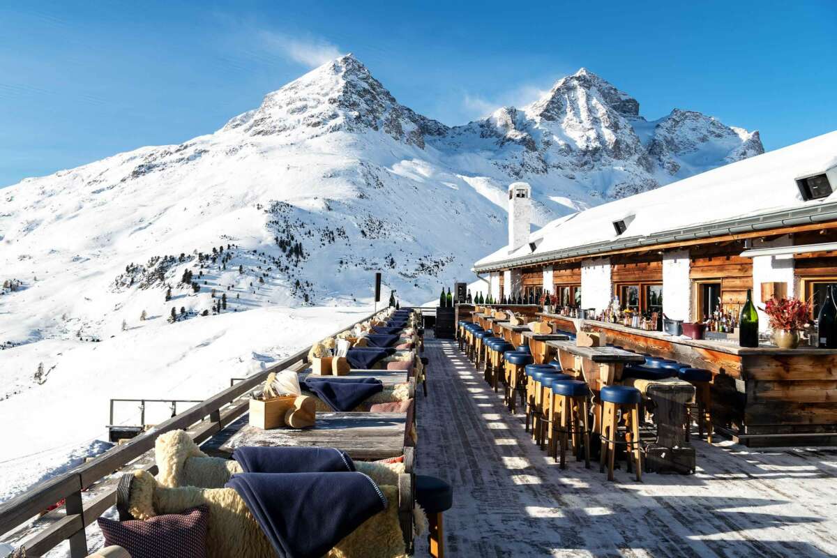 A sunny terrace of a restaurant and bar on the ski slopes 