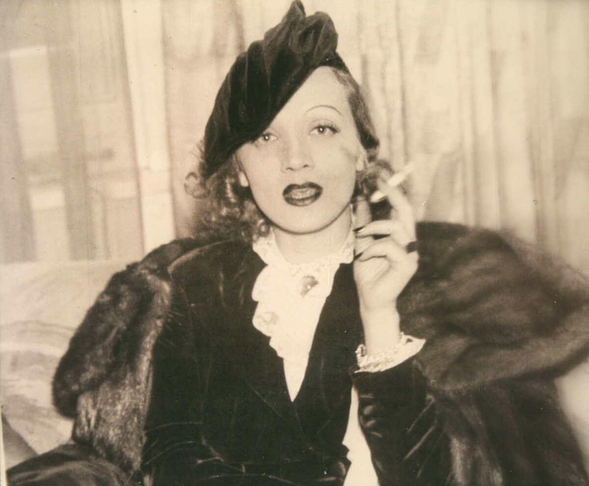 1930s archive image of glamorous woman smoking