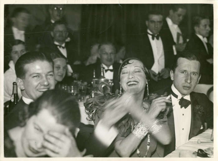 Archive image of revellers at a 1930s party