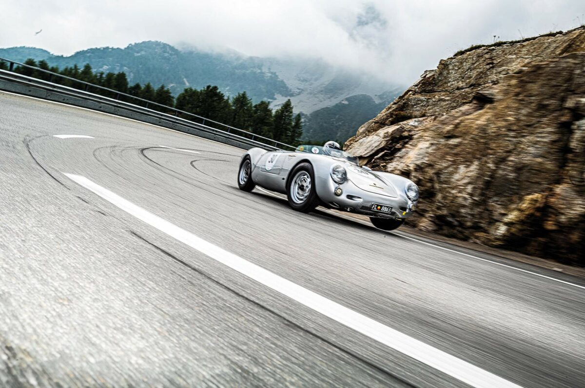 Classic car driving on mountain road