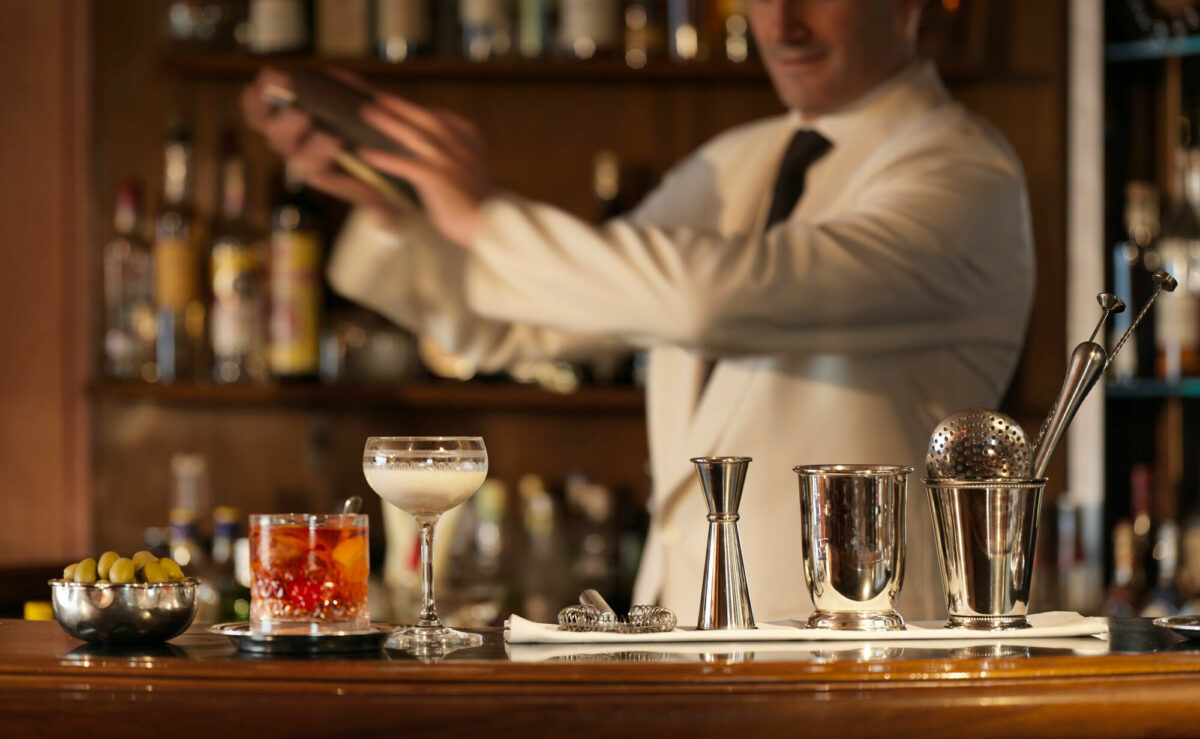 A mixologist crafting a mocktail at a hotel bar