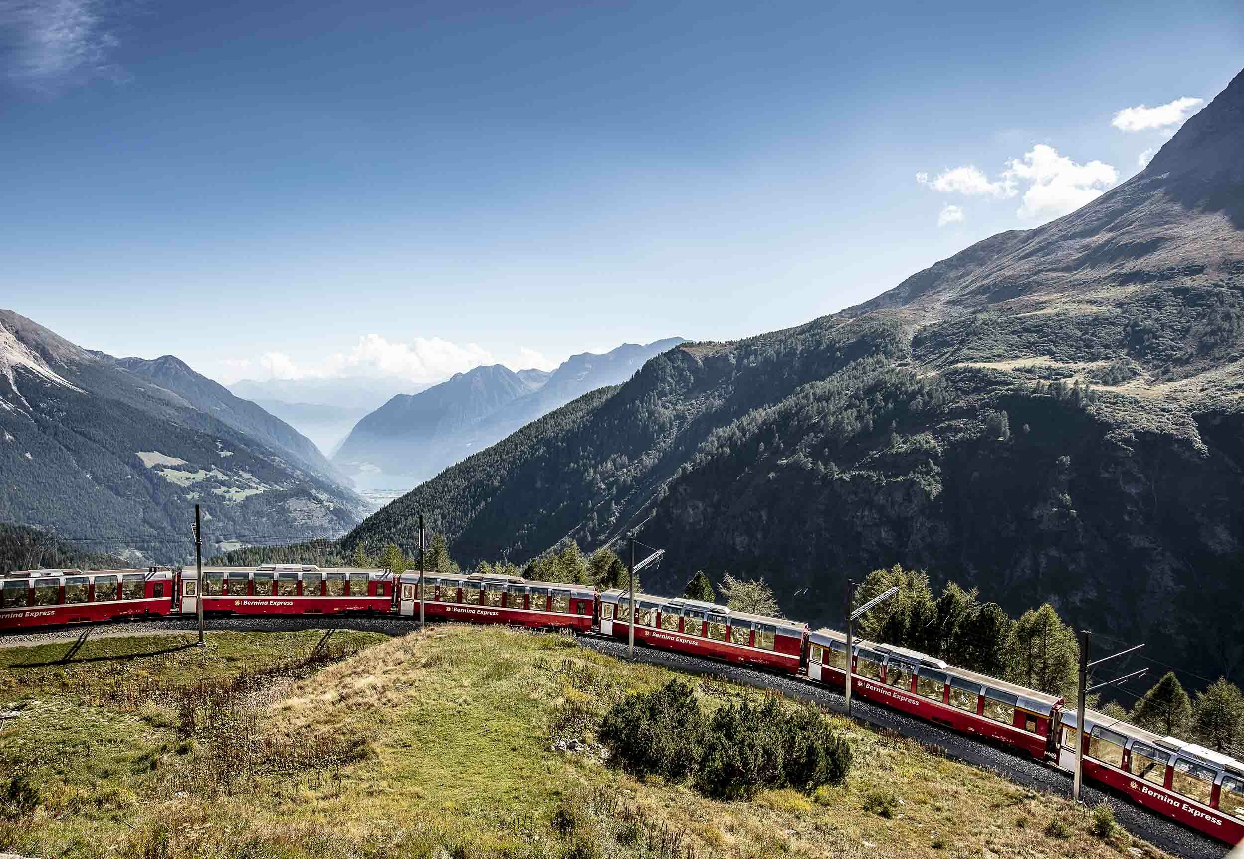 A train climbing up a mountain pass