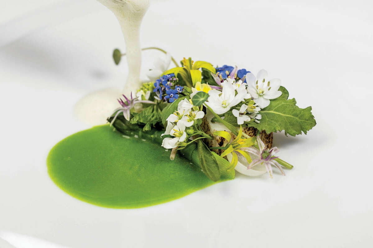 Flowers decorating a fine-dining dish.