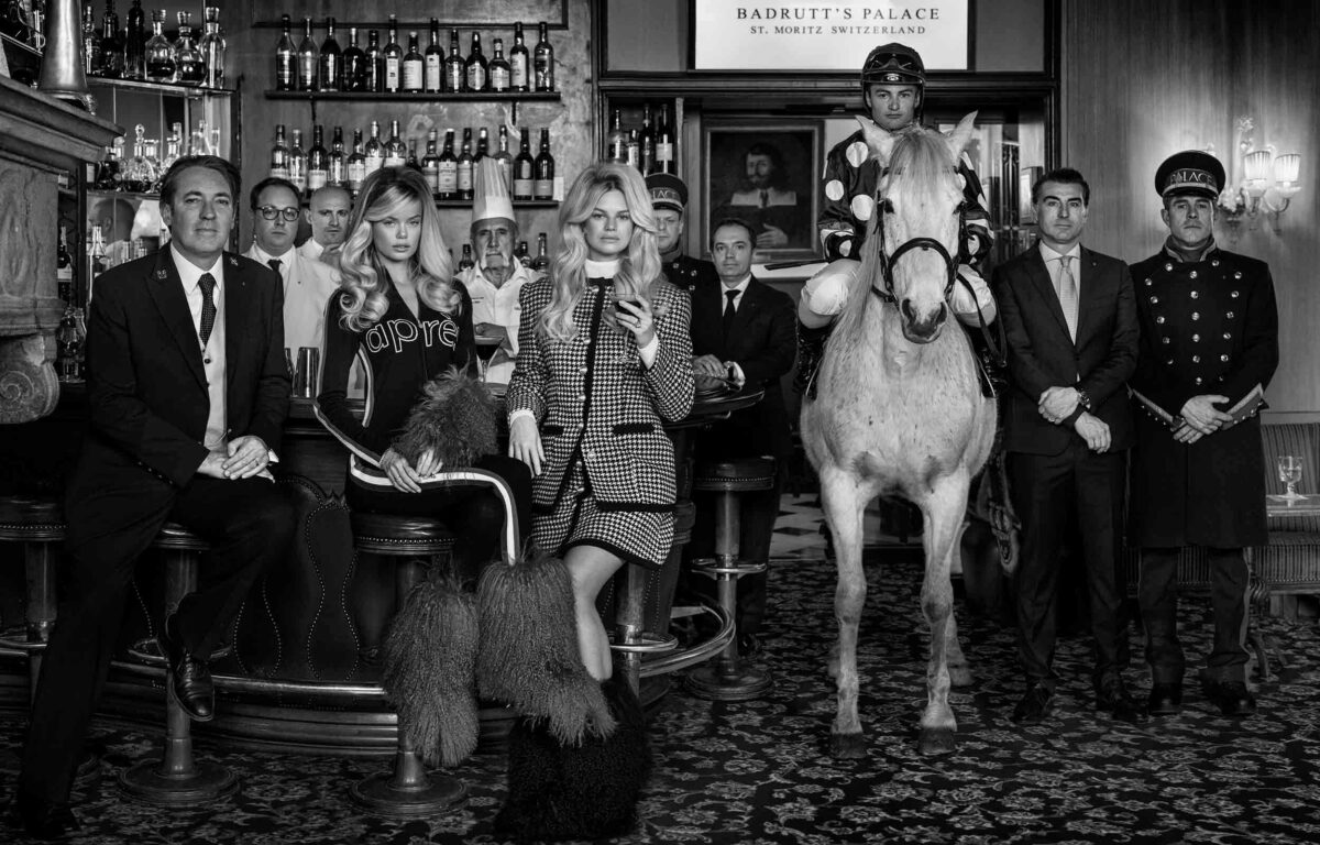 Man on horse with other people in a bar