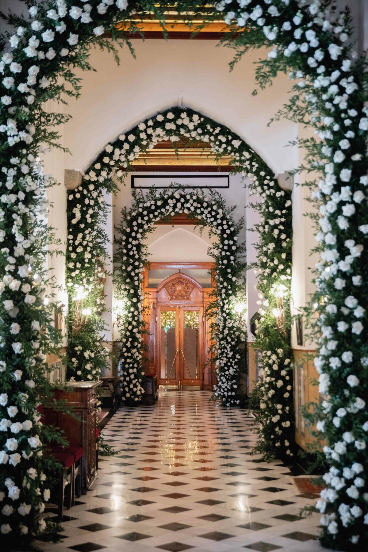 Flower covered arches in a hallway 