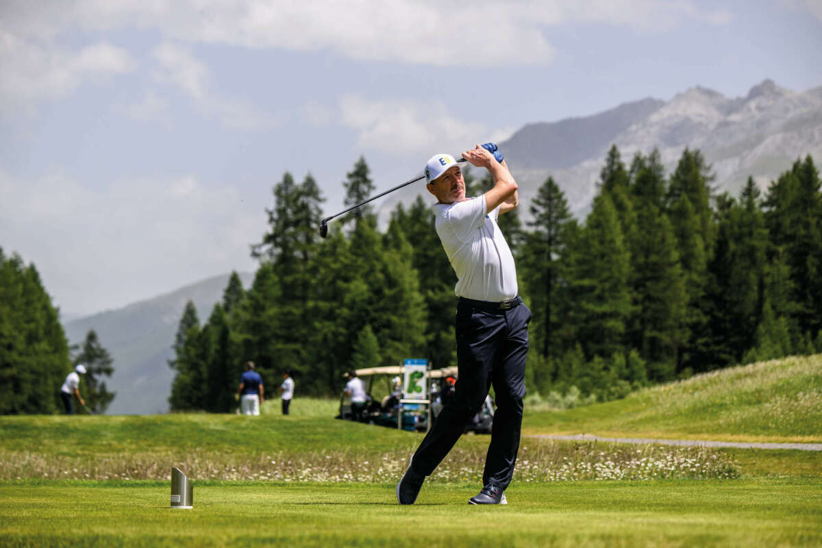 A man playing golf on a green in St. Moritz 