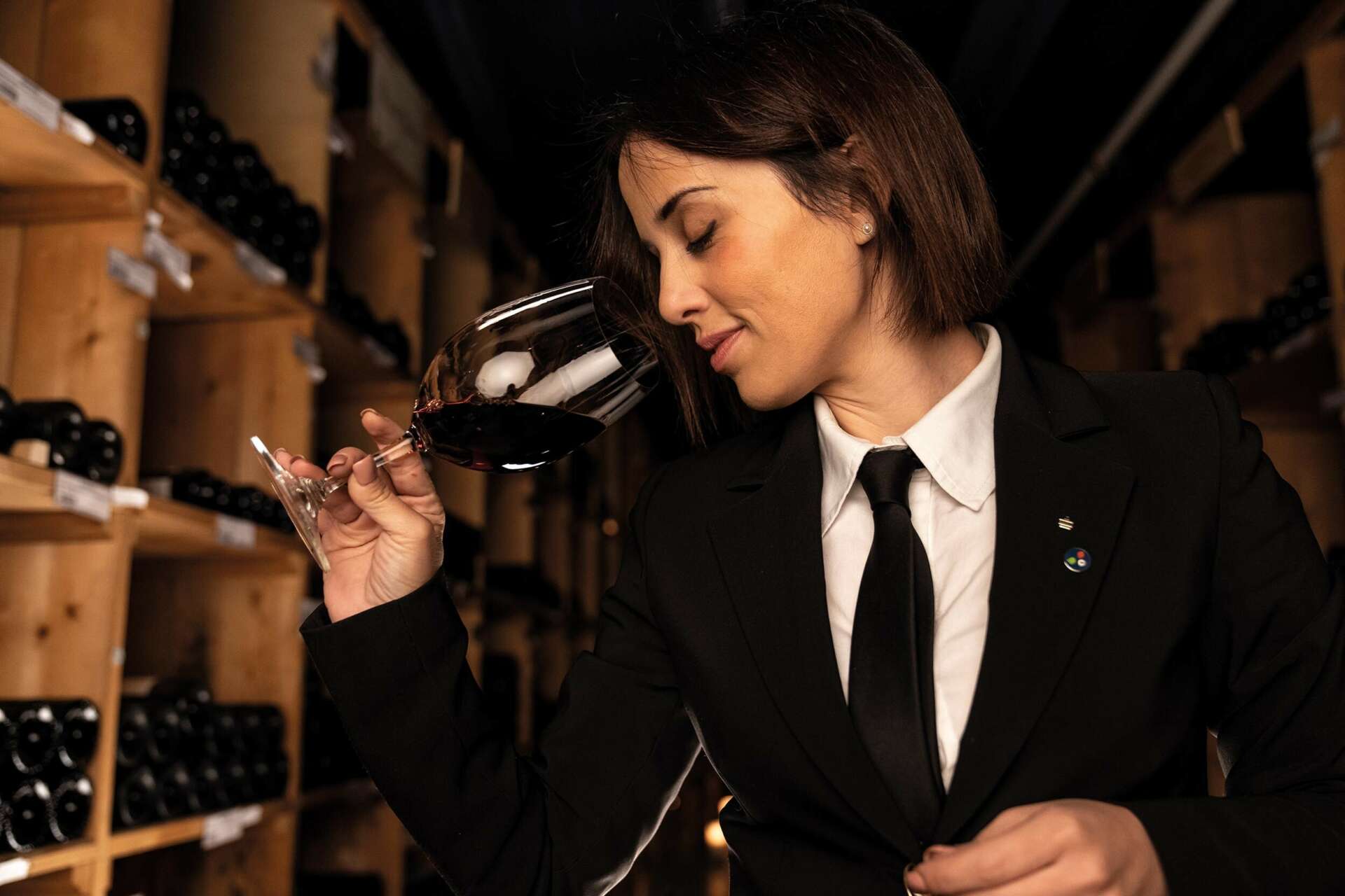 A sommelier with a glass of wine