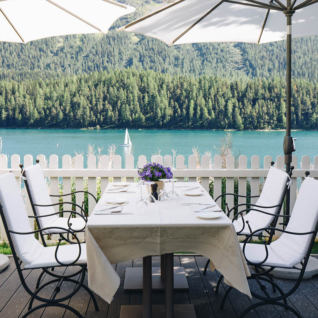 Restaurant table overlooking lake and forests