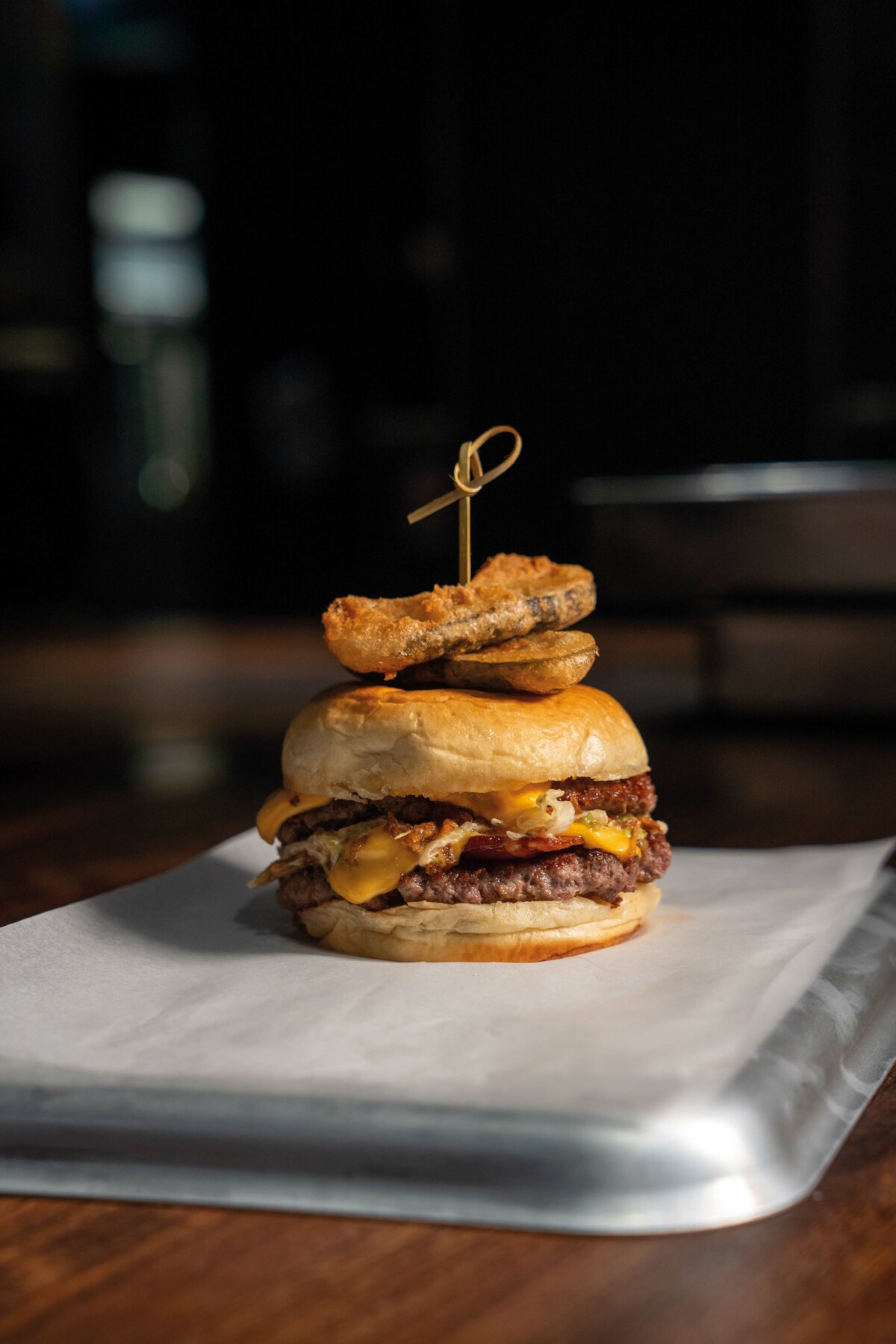 A gourmet burger on a tray