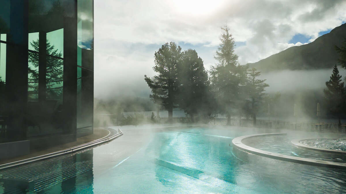 A steamy pool surrounded by the mountains of St.Mortiz