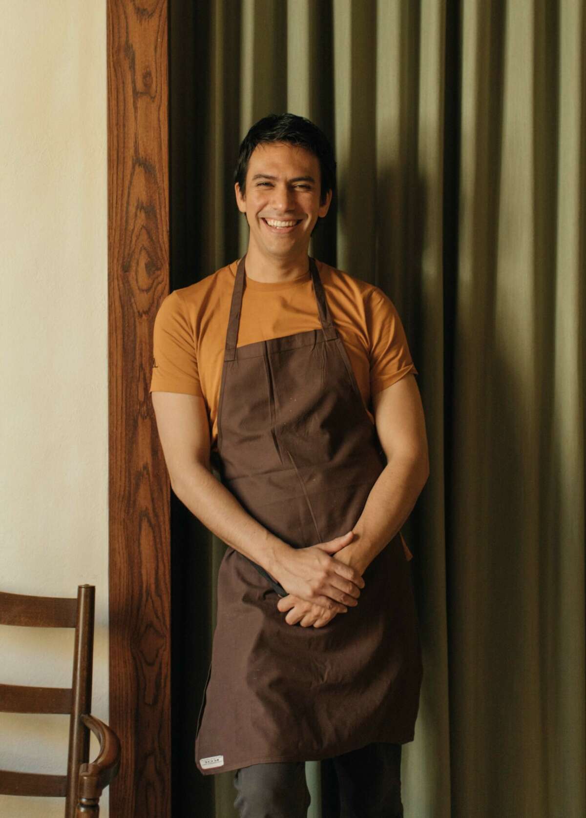 A smiling and relaxed chef